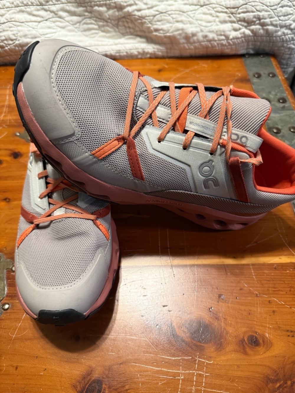 On Running Men’s Athletic Sneakers in Light Gray with Orange Accents